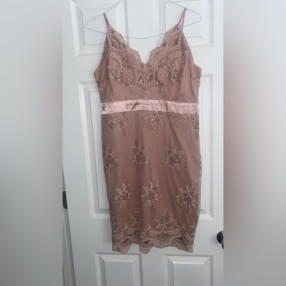Pink cocktail dress. Embroidered with flower details. Never been worn